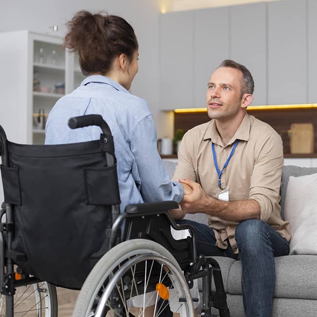 Woman in wheelchair getting advice - Independent Living Movement Ireland - DPCN | Disability Participation and Consultation Network