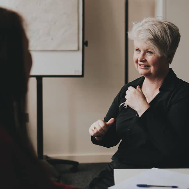 Women using sign language - Irish Deaf Society