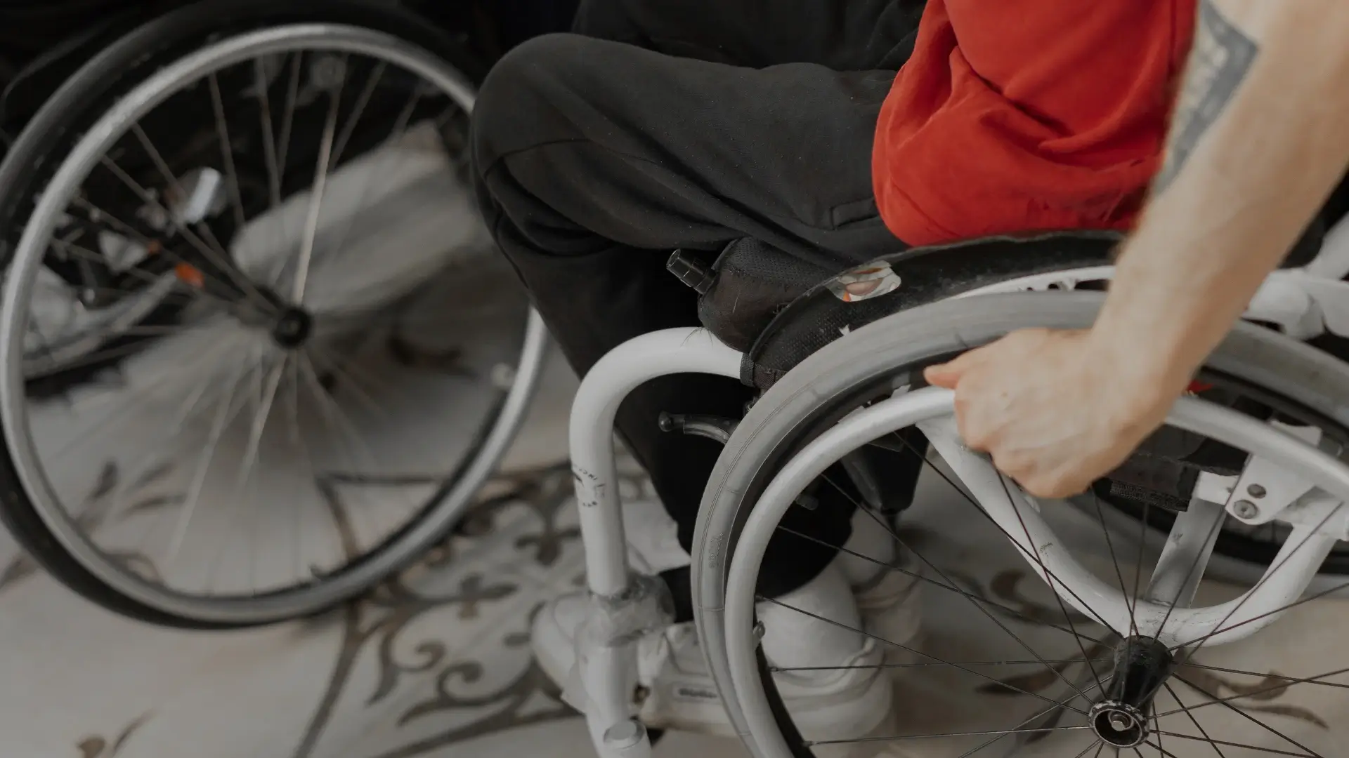 Disabled user navigating in wheelchair - Disability Federation Ireland | DPCN - Disability Participation and Consultation Network