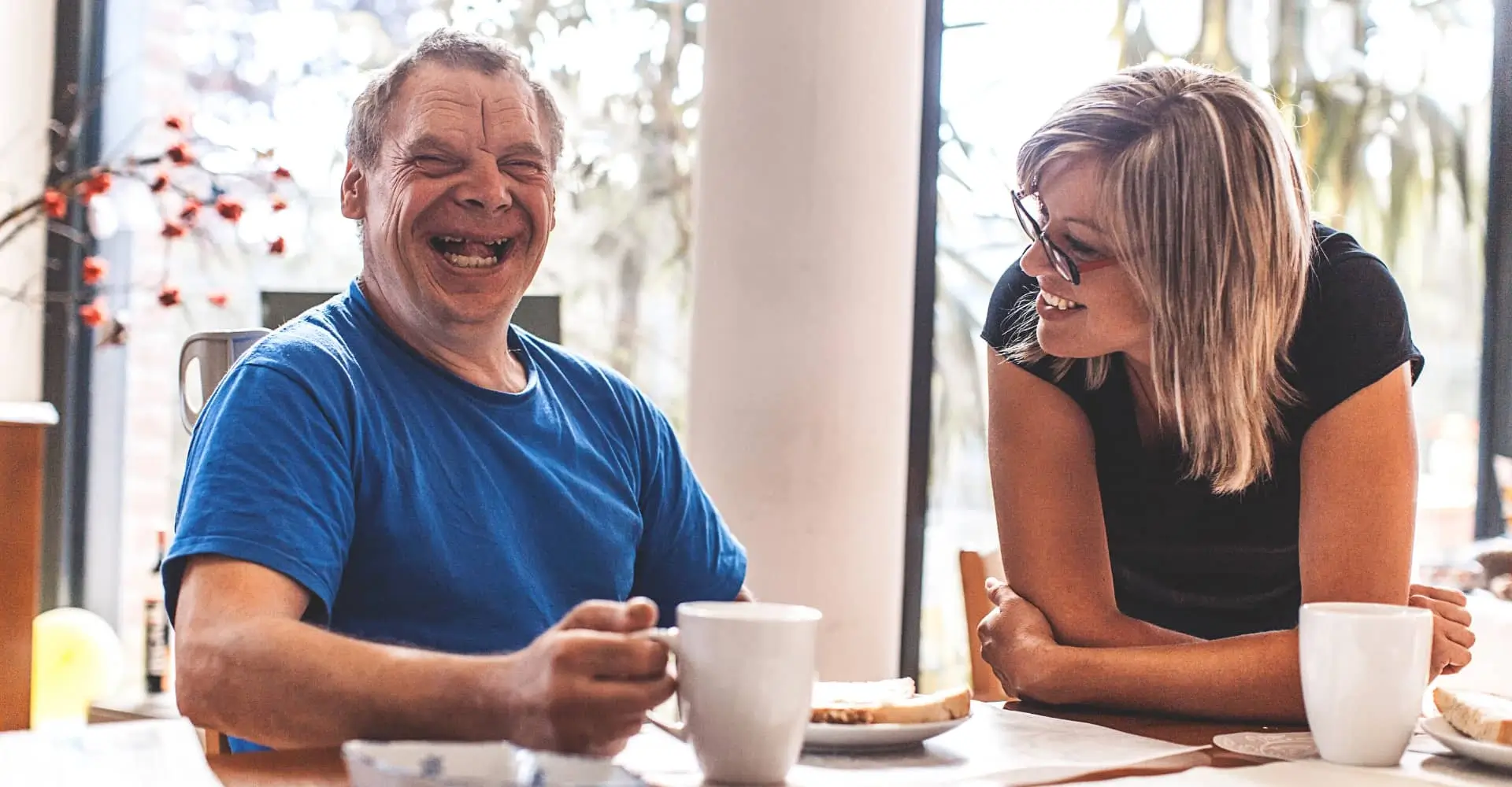 Man and woman enjoying a cuppa and a chat - DPCN | Disability Participation and Consultation Network