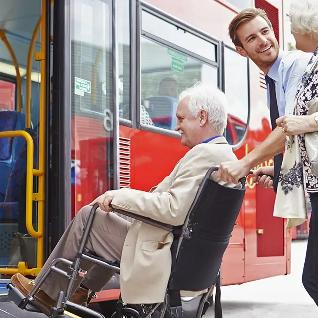 Wheelchair user being helped onto public transport - Physical Impairment Ireland | DPCN - Disability Participation and Consultation Network