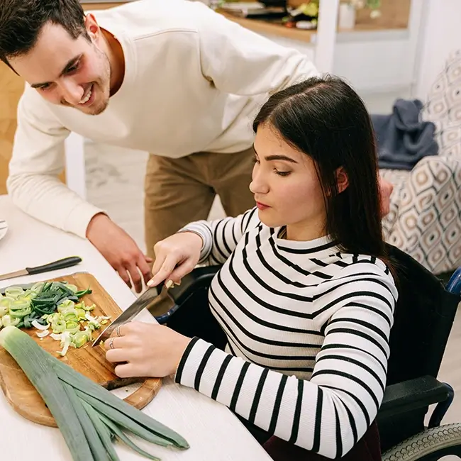 Woman in wheelchair preparing vegetables - Disabled Women Ireland | DPCN - Disability Participation and Consultation Network